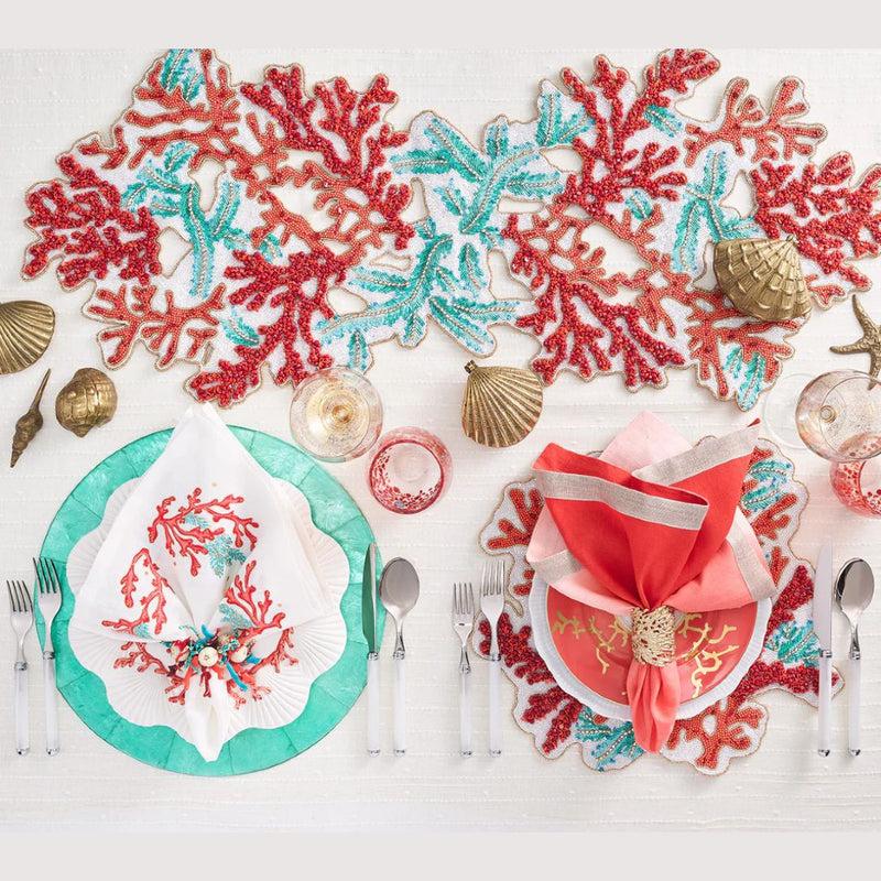 coral and turquoise table setting with runner and placemats 
