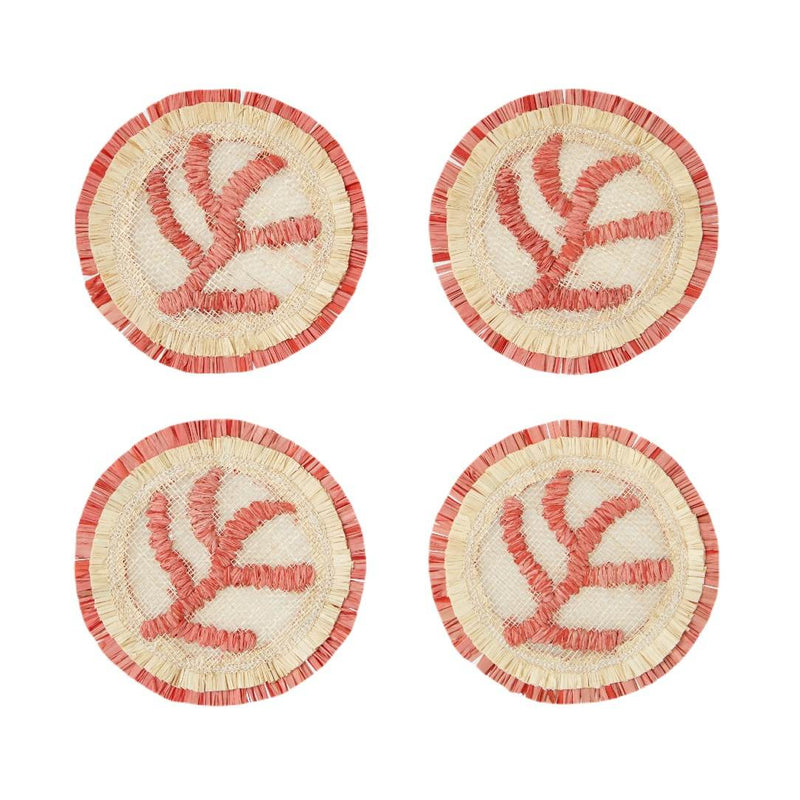 Four round coasters with coral designs on a white background
