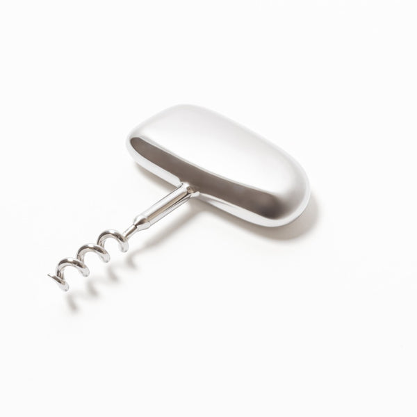 A polished stainless steel corkscrew with a sleek, flowing design, featuring an ergonomic handle and a traditional spiral corkscrew mechanism.