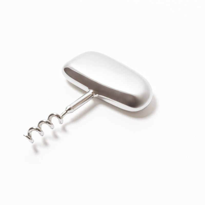 A polished stainless steel corkscrew with a sleek, flowing design, featuring an ergonomic handle and a traditional spiral corkscrew mechanism.