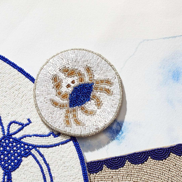 Crab beaded drink coaster set of 4 by Joanna Buchanan, styled coastal table decor
