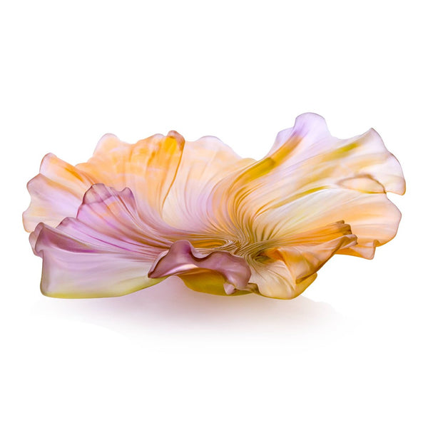 Glass sculpture of a flower with pink and yellow hues on a white background