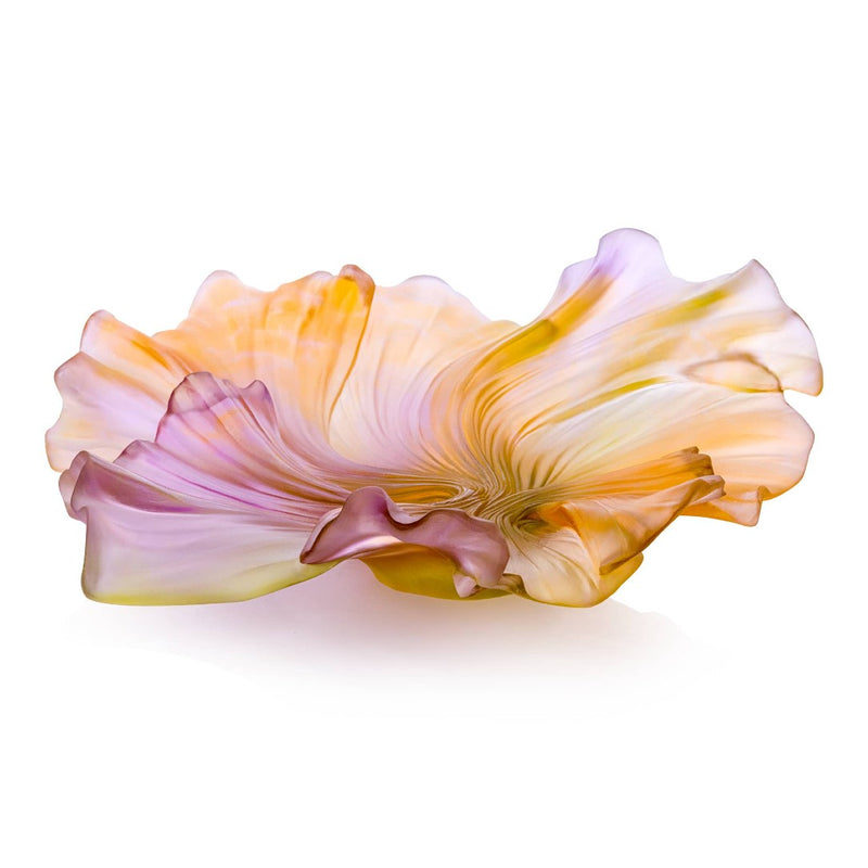 Glass sculpture of a flower with pink and yellow hues on a white background