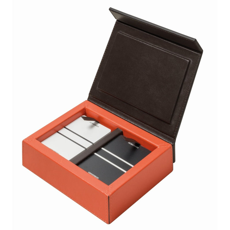 Open view of Crosera Playing Card Holder by Giobagnara showing two decks of luxury playing cards inside leather case.