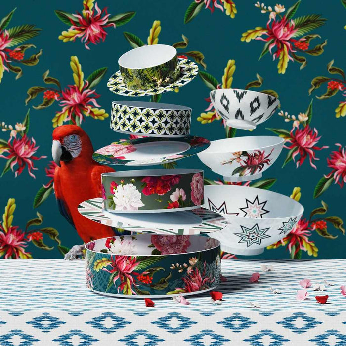 Styled stacked Paraiso small cylindrical porcelain bowl with tropical motifs in green, pink, and yellow by Sieger by Fürstenberg
