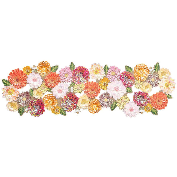 A decorative table runner featuring a floral pattern with shades of pink, orange, and purple sequins and beads on a cotton backing.