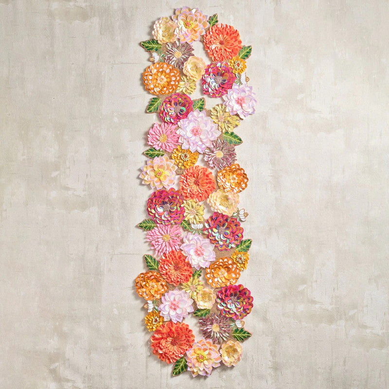 decorative orange and pink runner on a beige textured table