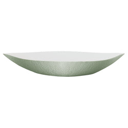 An elongated round white porcelain deep dish with a greenishceladon edge and interior, with a matte finish.