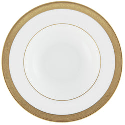 A white and gold porcelain soup and pasta plate with a floral pattern and a gold border.