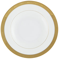 A white and gold porcelain soup and pasta plate with a renaissance style border and inlaid decorations.