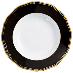 Porcelain deep plate with scalloped rim black border and gold edge from mazurka gold and black collection by raynaud on a white background