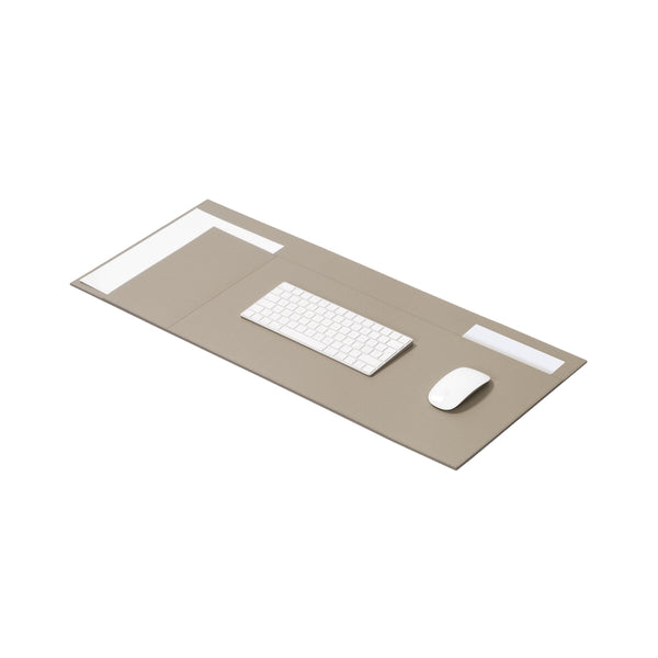 A beige leather desk blotter organizer with multiple compartments, displayed with a keyboard and mouse on top.