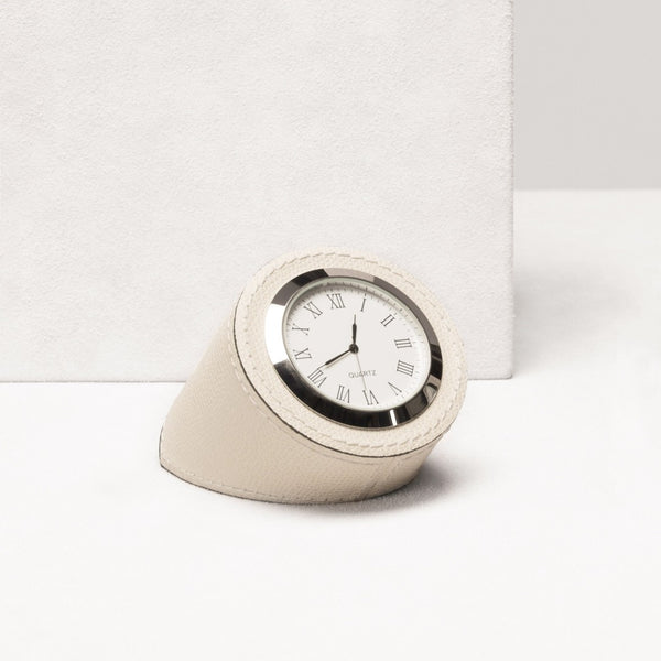 Round clock with beige casing on a white background