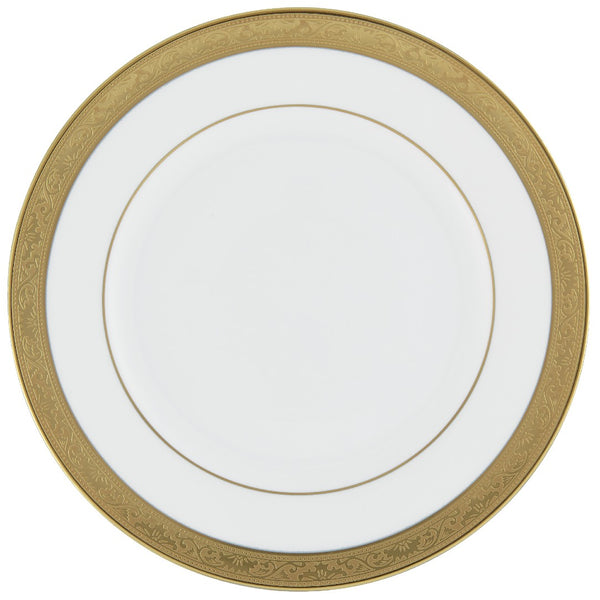 A white and gold porcelain plate with a floral pattern and a gold border.