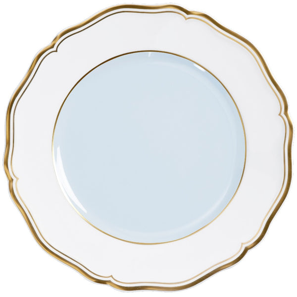 A porcelain dessert plate with a blue grey center and a gold border.