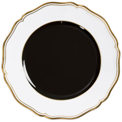Porcelain dessert plate with black center scalloped rim and gold edge from mazurka gold and black by raynaud on a white background