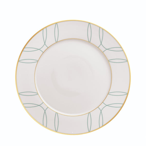 White plate with green leaf pattern and gold rim on a white background