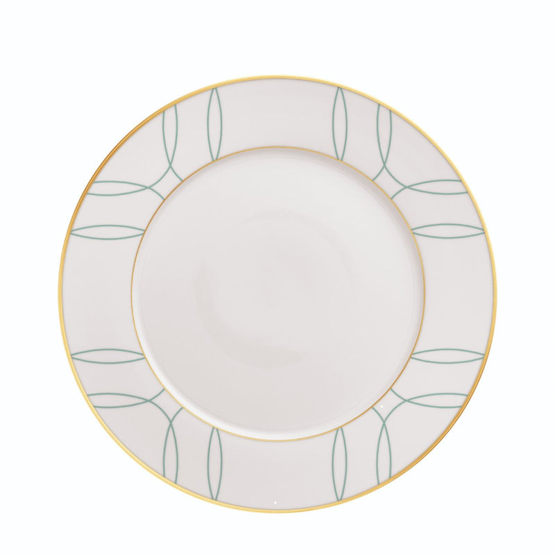 White plate with green leaf pattern and gold rim on a white background
