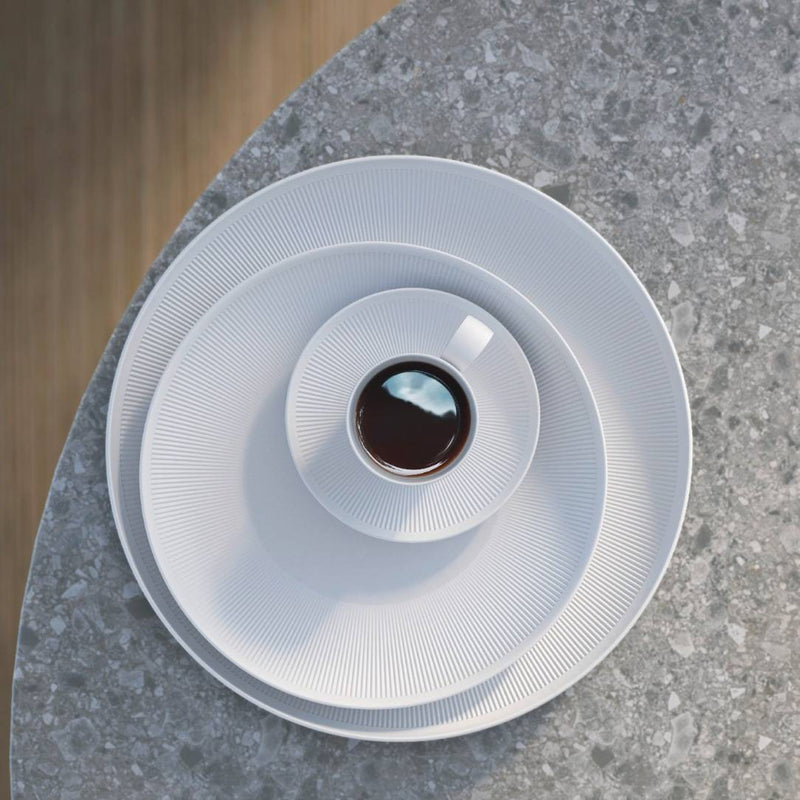 White coffee filter with coffee inside on a gray stone surface