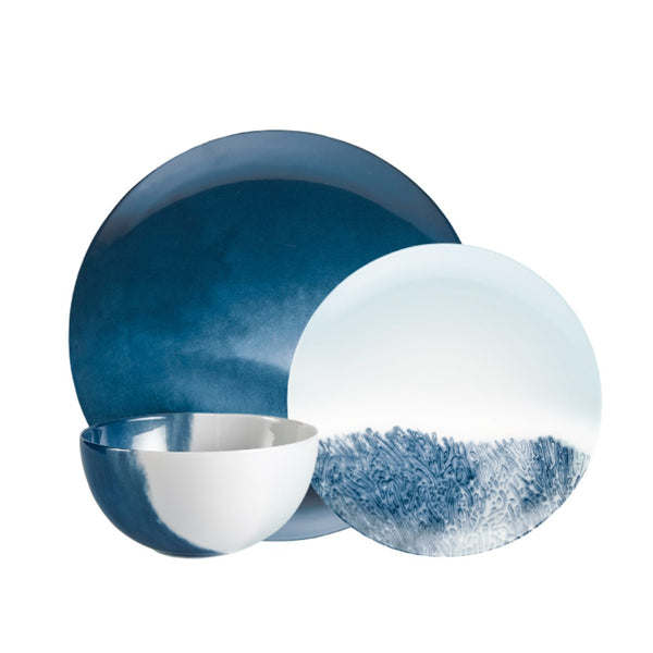 Abysses 12-piece porcelain dinnerware set by Raynaud with indigo marine design on a white background