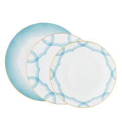 Aura dinnerware set of 12 pieces by Raynaud—Limoges porcelain with golden scalloped medallion and shaded blue line design.