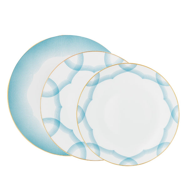 Aura dinnerware set of 12 pieces by Raynaud—Limoges porcelain with golden scalloped medallion and shaded blue line design.