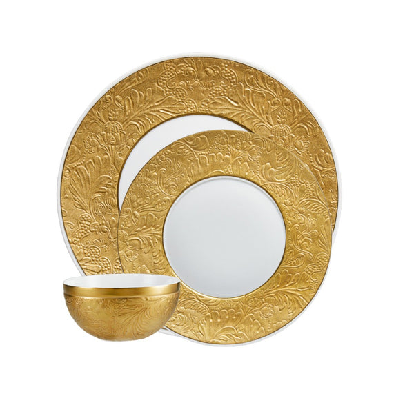 Raynaud Italian Renaissance Gold 12-piece Limoges porcelain dinnerware set with embossed arabesques and gold finish.