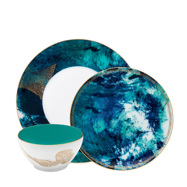 Océan Bleu Dinnerware Set of 12 by Haviland in Limoges porcelain with hand-painted blue tones inspired by waves, jellyfish, and manta rays.