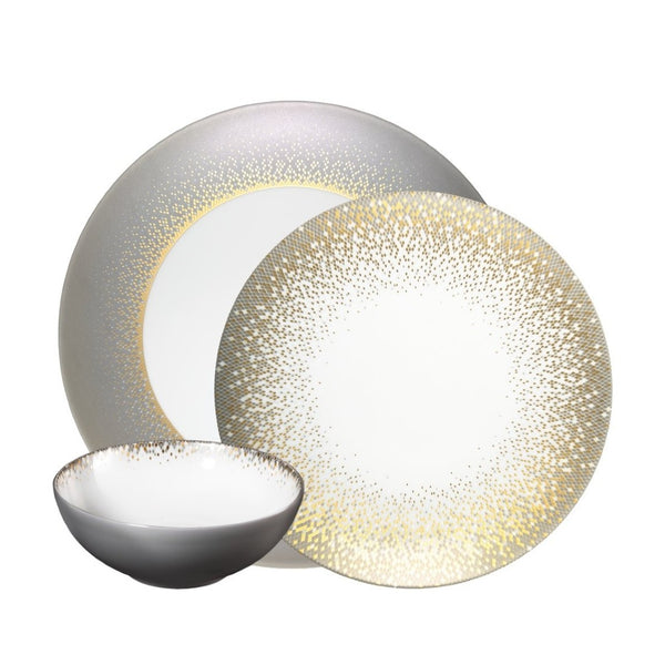 Souffle d’Or 12-piece dinnerware set by Haviland in handmade Limoges porcelain, inspired by a supernova with grey and matte gold accents.