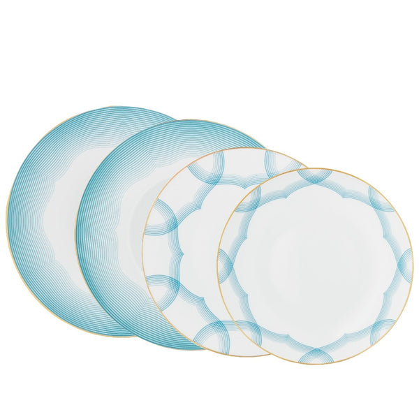 Aura dinnerware set of 16 pieces by Raynaud—Limoges porcelain with golden medallion and shaded blue line detailing.