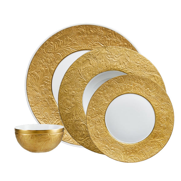 Raynaud Italian Renaissance Gold 16-piece Limoges porcelain dinnerware set with embossed arabesques and gold finish.