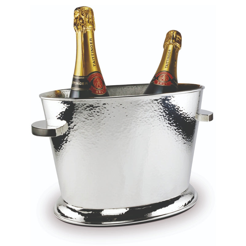 A silver-plated hammered champagne cooler with two bottles of champagne inside, designed by Sonja Quandt.