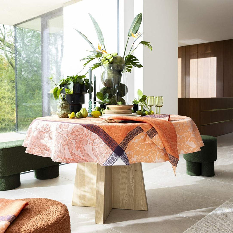 Modern interior with a round table and decorative plants
