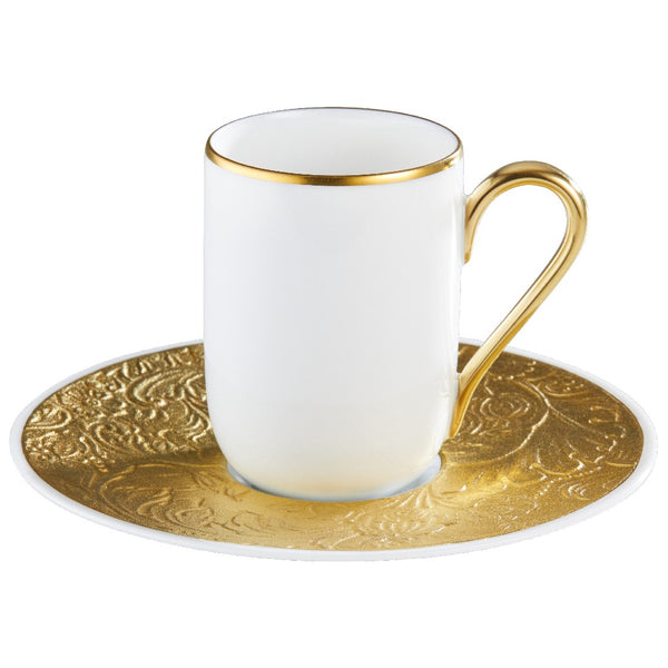 Porcelain espresso cup with gold rim and handle, paired with an embossed gold saucer from the Italian Renaissance Gold collection by Raynaud.