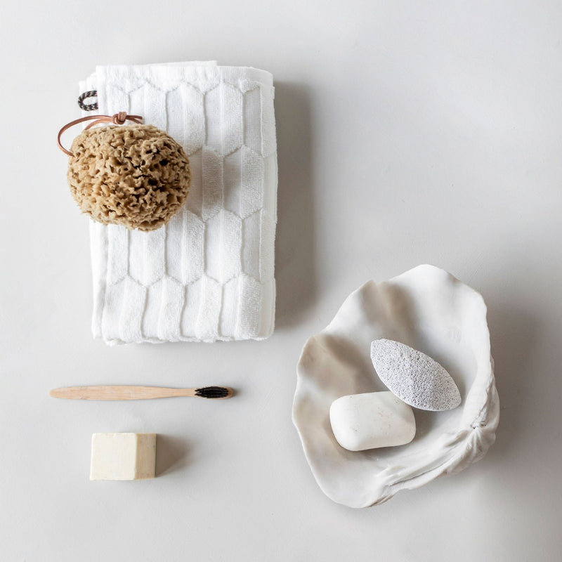 Small white faux shell decorative accent as a bathroom accent
