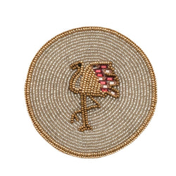Round beaded coaster with a bird design on a white background