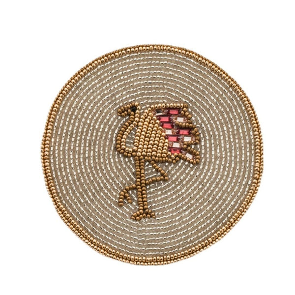 Round beaded coaster with a bird design on a white background