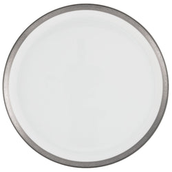 A round porcelain cake serving plate with a white center and a platinum border with Renaissance style decorations.