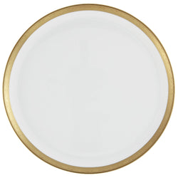 A white porcelain cake serving plate with a gold border and inlaid gold details on a white background.