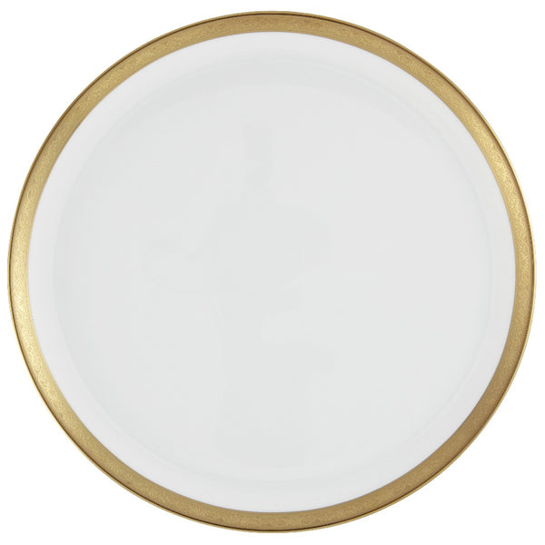 A white porcelain cake serving plate with a gold border and inlaid gold details on a white background.