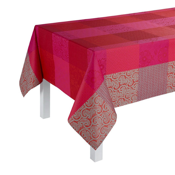 Red and pink checkered tablecloth with decorative patterns on a white background