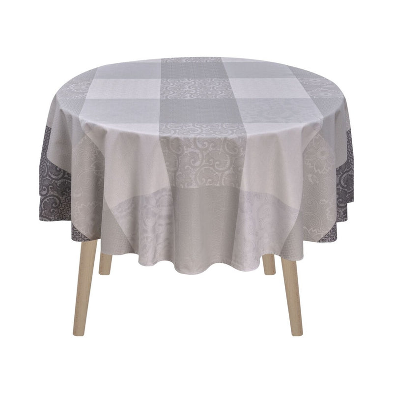 Round table with a checkered tablecloth on a white background