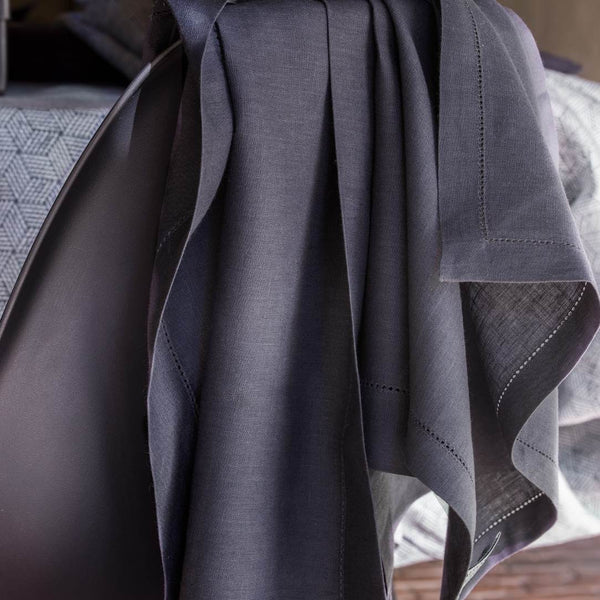 Gray fabric draped over a textured surface