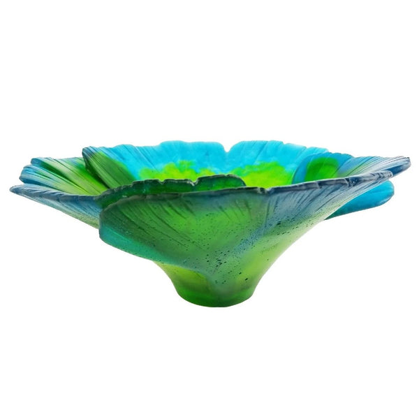 Glass bowl with blue and green design on a white background