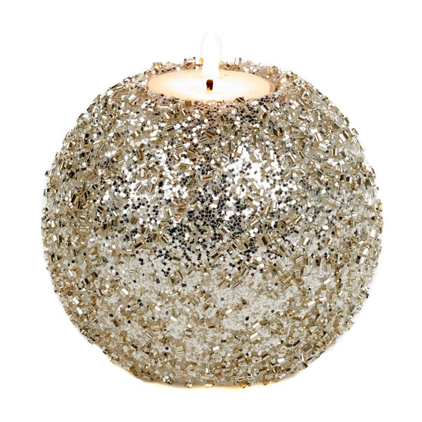 Decorative candle holder made of glittery material on a white background