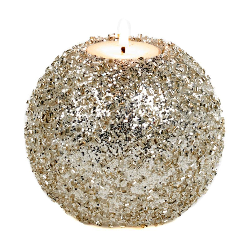 Decorative candle holder made of glittery material on a white background