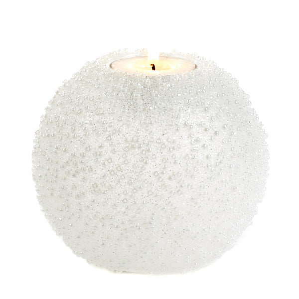 Spherical candle holder with textured surface on a white background
