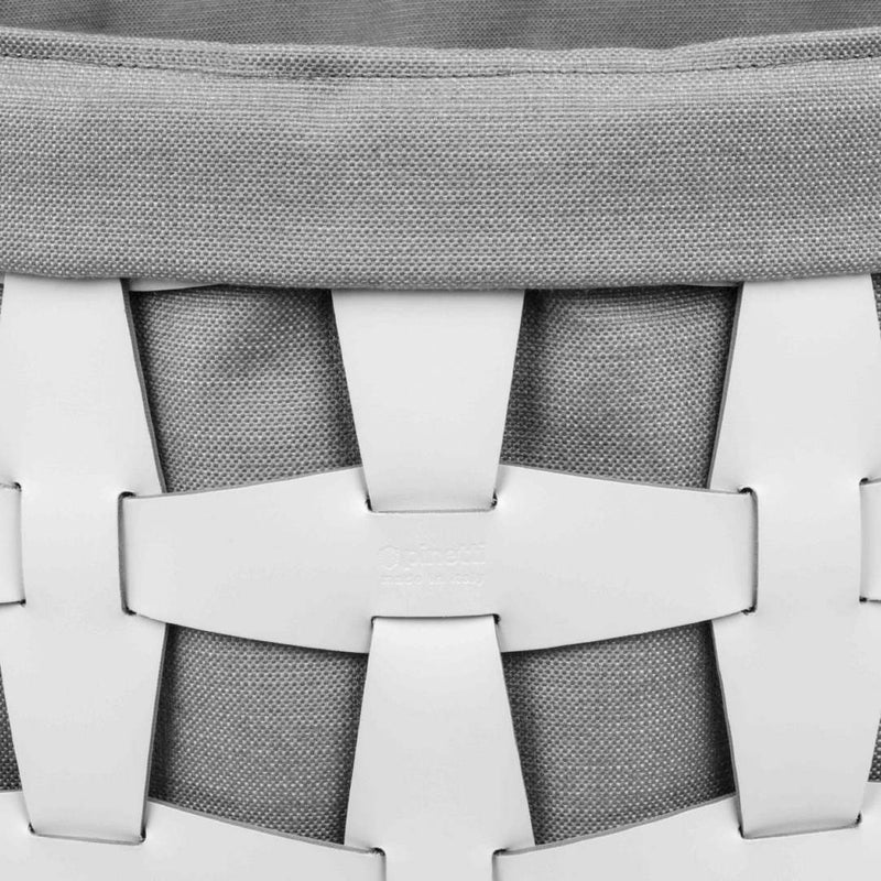 Close-up of a woven basket with a gray top and white base.