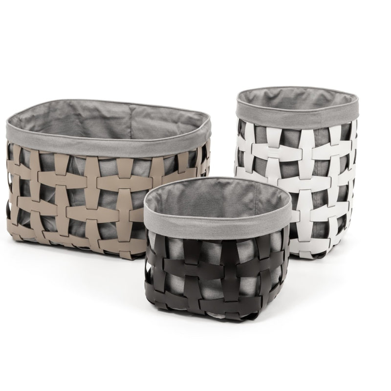 Three woven baskets with gray fabric interiors on a white background