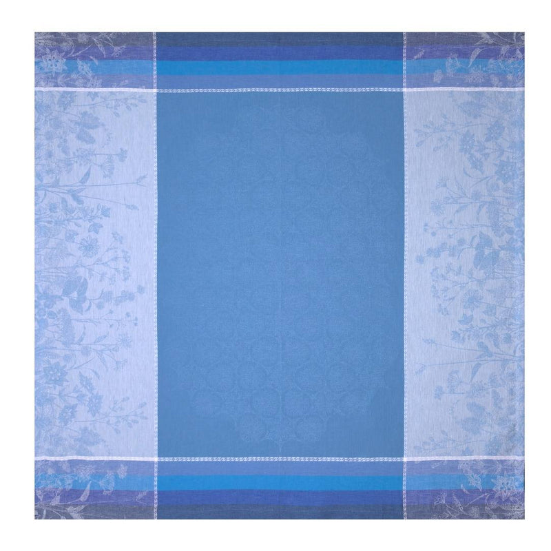 Blue checkered fabric with floral patterns on a white background